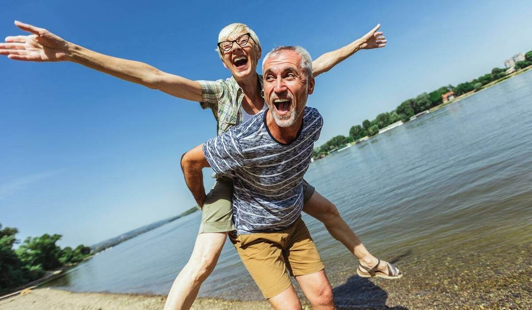 Joyful couple on the beach