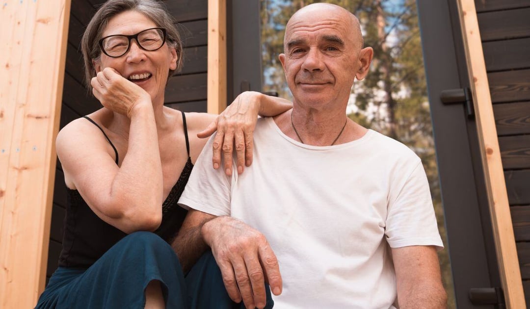 Mixed race senior couple on their porch