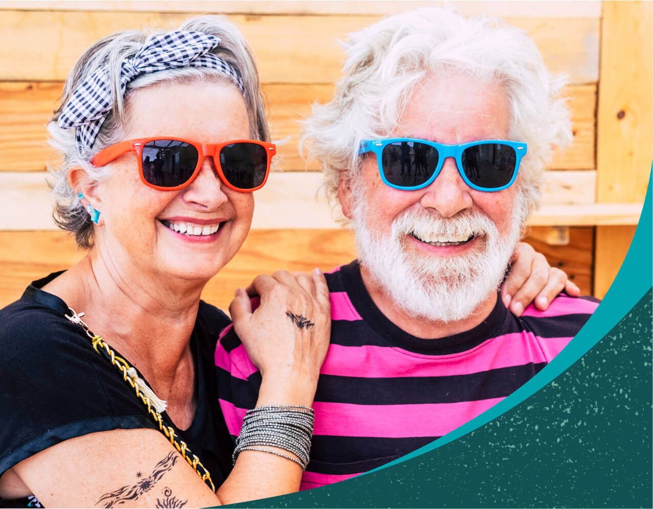 Senior white couple wearing sunglasses and smiling