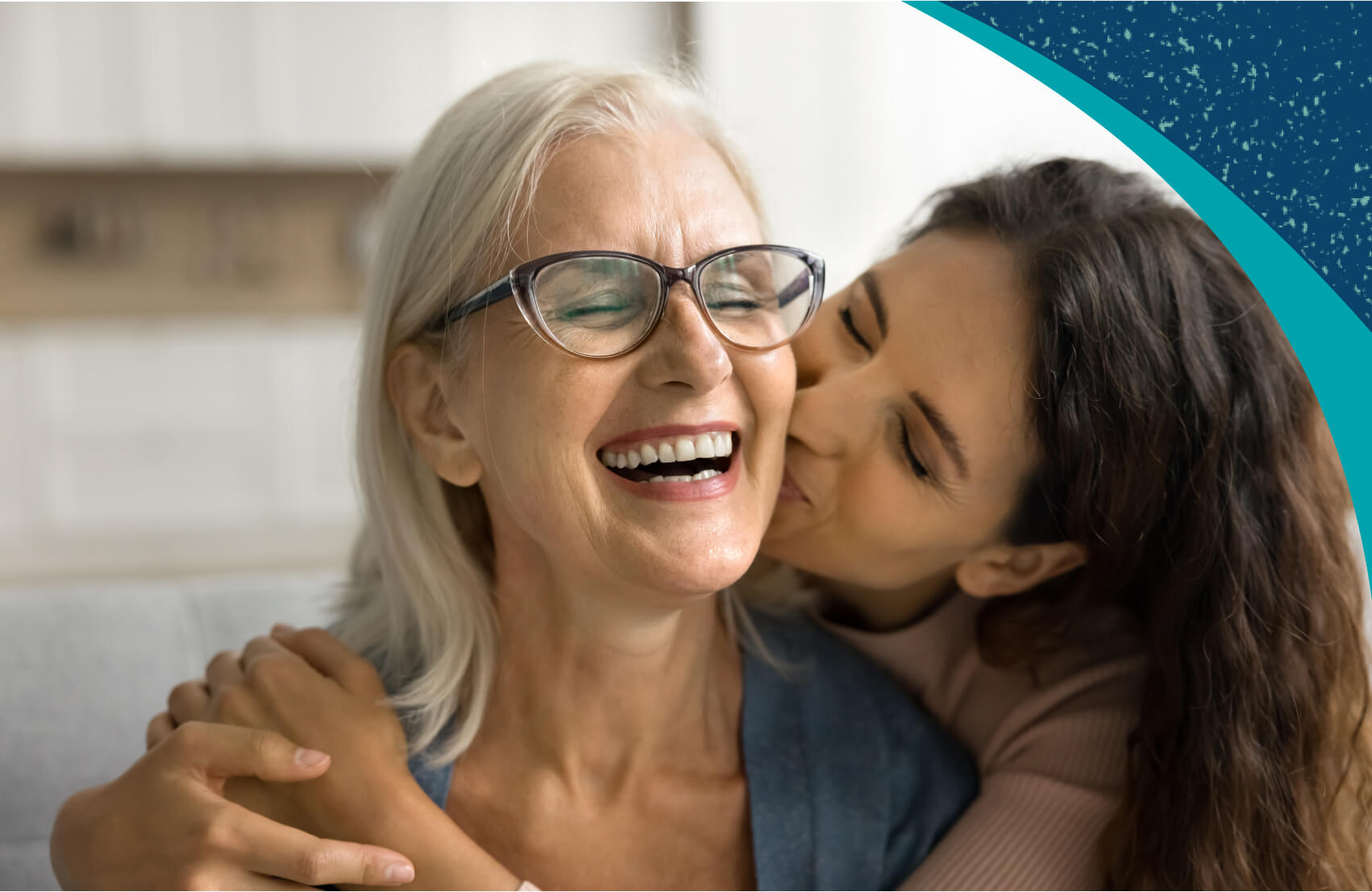 Woman and adult daughter embracing